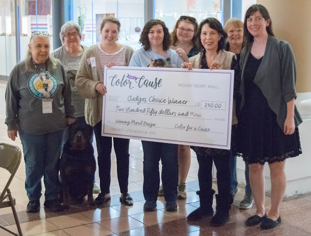 Compassionate Paws with the big check