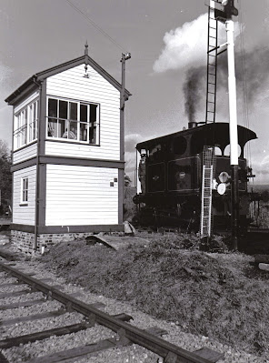 Former Belgian steam tram 'Yvonne' stands next to signal box on the Northampton & Lamport Railway