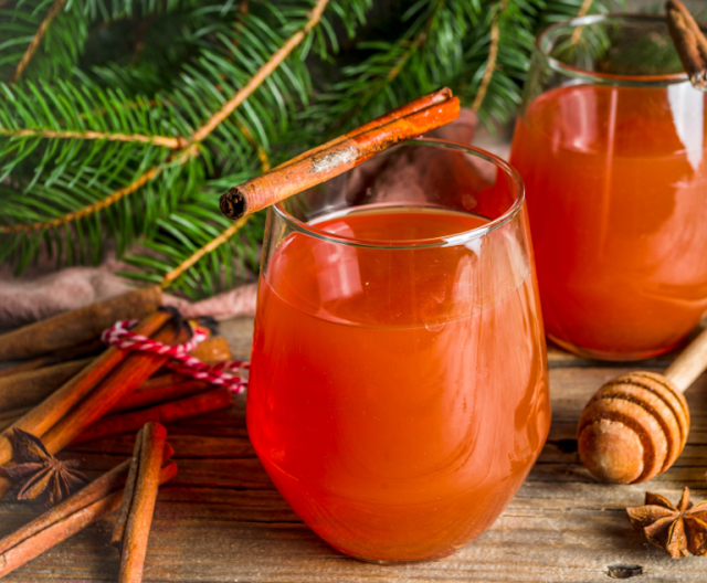 Two glass-mugs filled with hot wassail