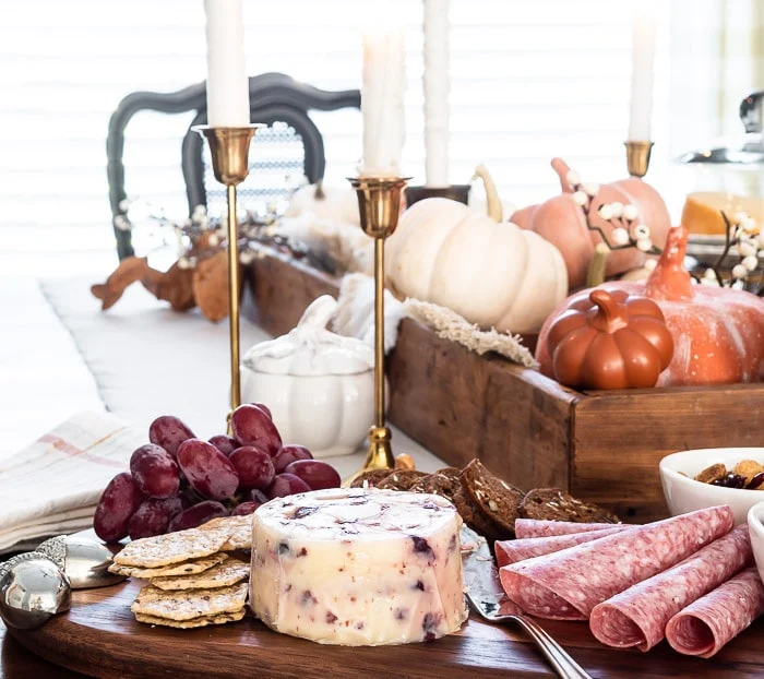 pumpkins, candles, charcuterie board