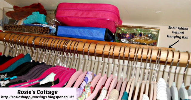 Narrow shelf placed BEHIND the hanging rail is ideal for accessories