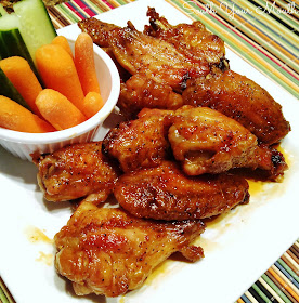 Crispy Baked Chicken Wings with Sweet Asian Hot Wing Sauce! The secret to CRISPY wings baked in the oven! These chicken wings are amazingly easy and just as good and crispy as fried wings. Plus a recipe for sweet Asian hot wing sauce.