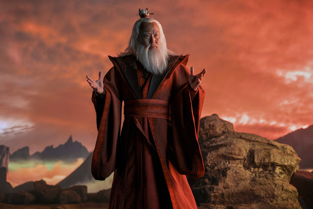 C.S. Lee as Avatar Roku stands on a mountain wearing red robes in season 1 of ‘Avatar: The Last Airbender’