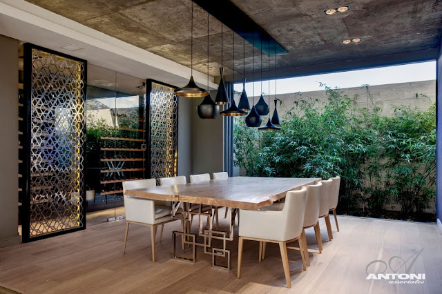 Modern dining room with open glass wall 