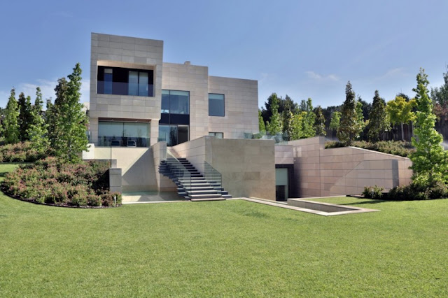 Green grass and modern mansion in Madrid 