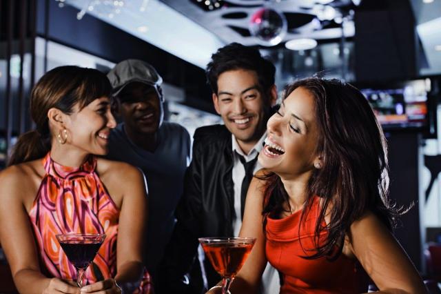 Picture of friends at a bar having drinks