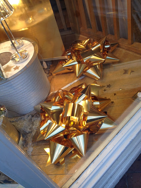 giant gold rosettes in shop window