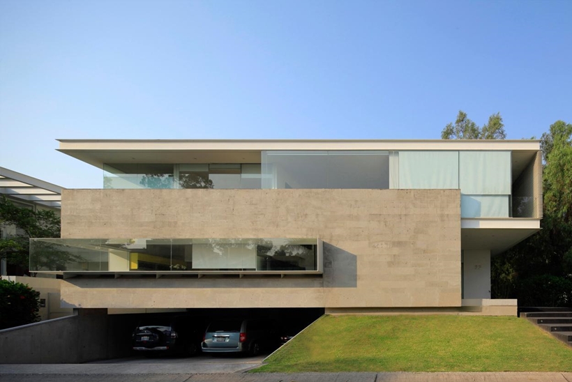 Concrete and glass facade on Godoy House by Hernandez Silva Arquitectos in Mexico