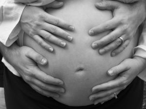 Image: Four Hands on Belly. Photo credit: Elliott McFadden on FreeImages