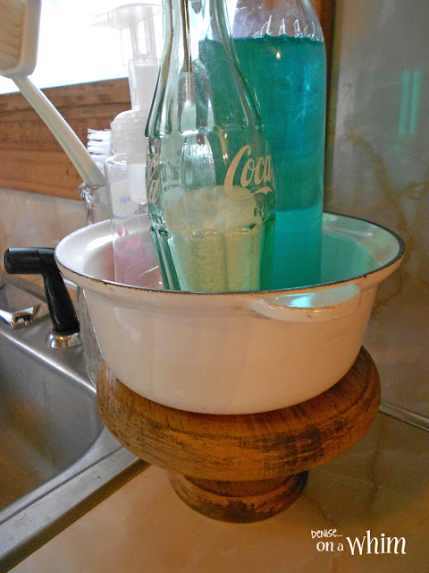 Le Creuset Enamelware Saucepan on a Pedestal Stand for Holding Kitchen Soaps | Denise on a Whim