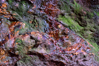 Colorful rock walls at Rio Viejo, Puriscal