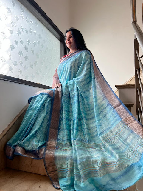 Unraveling the Turquoise Blue Pashmina Silk Shibori Hand-Dyed Saree with Zari Border