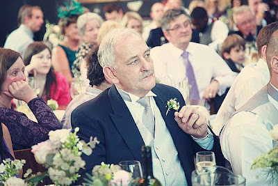 wedding guest listening carefully to a speech at St Chads place