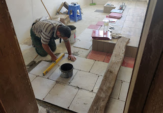 Bekir works on the tiling