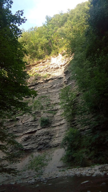 a view of the cliffs, with the sun lighting up the peak