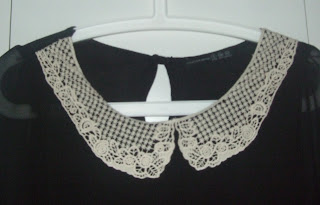 cream lace collar on black blouse