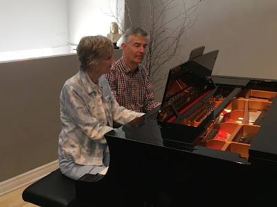 Two pianists play a duet