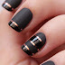 Elegant Black and Golden Nail Design. 