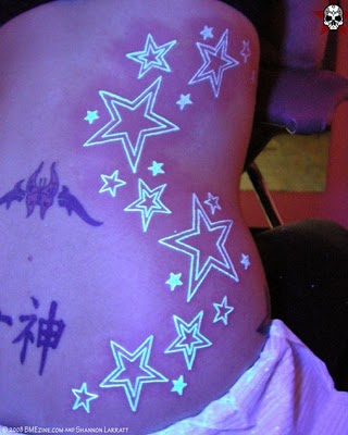 tree tattoos on side. stars tattoos on side. tattoos