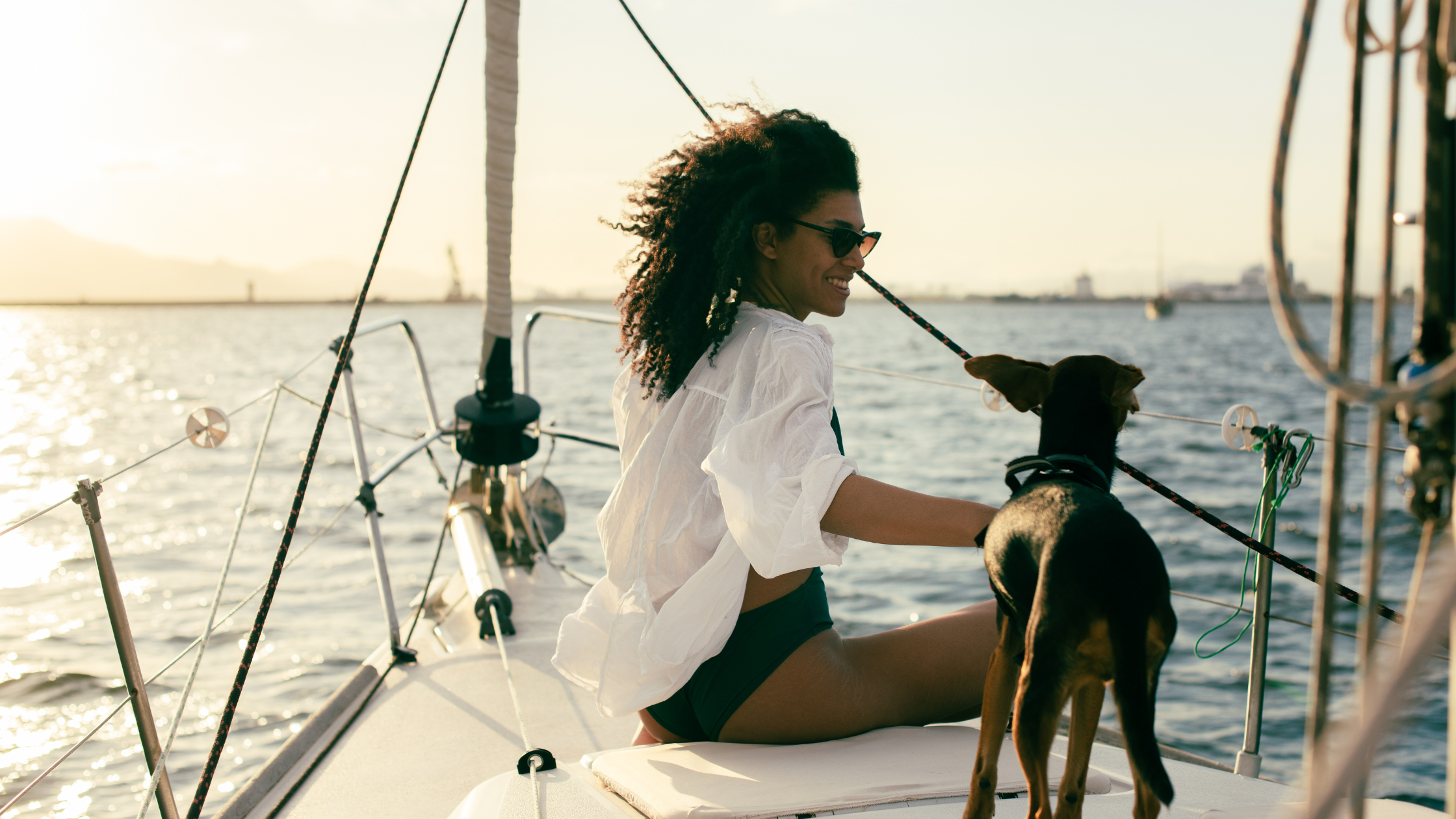 Lady on a boat with her dog