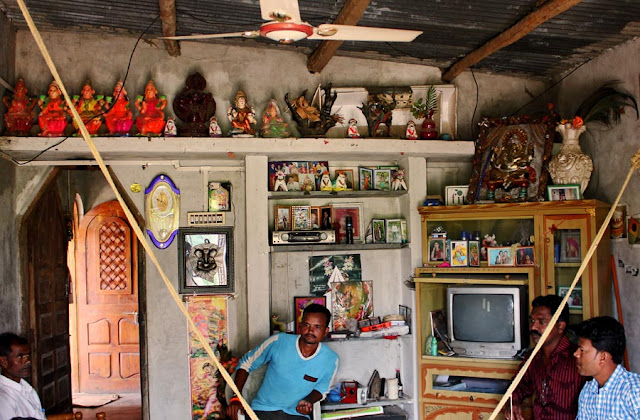 Hindu idols on shelf in living room