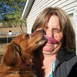 our daschund Dixie licking my wife Cindy in the face