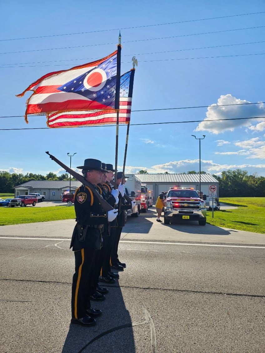 sheriffs in parade carrying flags