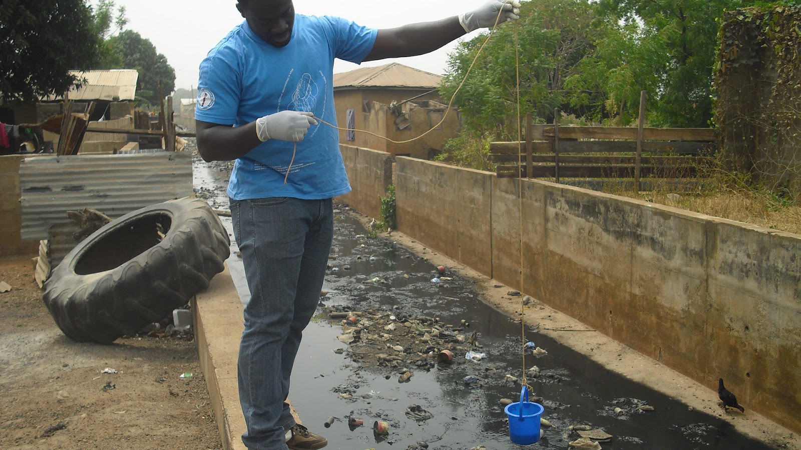 collecting sereage sample for analysis in Ghana