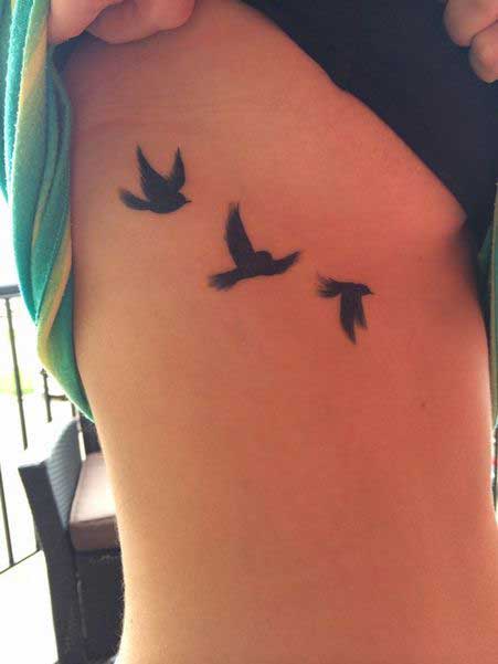 Hummingbird Flying Pic Tattoo On Side Stomach