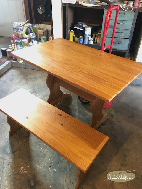 beat up old farmhouse table before update with general finishes gel stain and paint