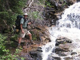 Rich posing at one of the numerous waterfalls along the trail up to Chicago Basin