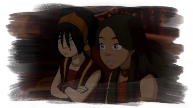 A shot of Katara, a fourteen-year-old girl with long brown hair and blue eyes, sitting with Toph, who is sitting with her arms crossed, annoying in a theatre seat. Both Toph and Katara are wearing red and gold, fire-themed outfits. Katara is looking at something off-screen.