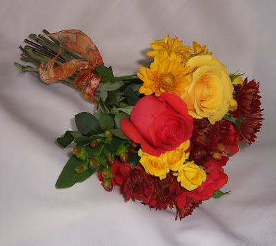 Fall Wedding Bouquets This bouquet includes three orange roses 