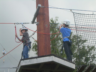 Wil and Sam on a platform of the ropes course