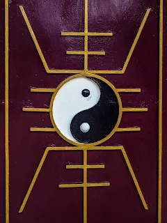 a beautifully painted door with the black and white ying and yang symbol