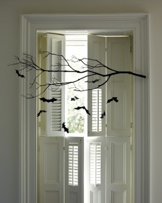 Peek into your backyard to find a dry branch then make some bats from black papers. Hang the bats on the branch with some string and your guests will be impressed with this Halloween decoration.