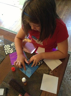 Bella Making her Foil Art Project
