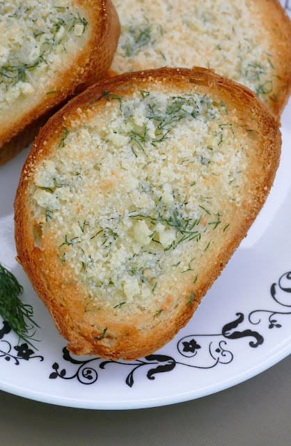 This delicious garlic bread is such a great addition to any meal. The grated parmesan cheese and fresh dill adds a unique pop of flavor to the buttery french bread slices! Easy and ready in less than 15 minutes!