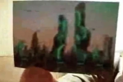 The picture shows odd-shaped green buildings (Image: APEXTV/Youtube).