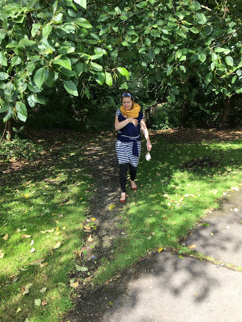 new mom babywearing out on a walk fourth trimester