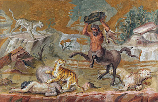 A centaur/Kinnara fighting a tiger