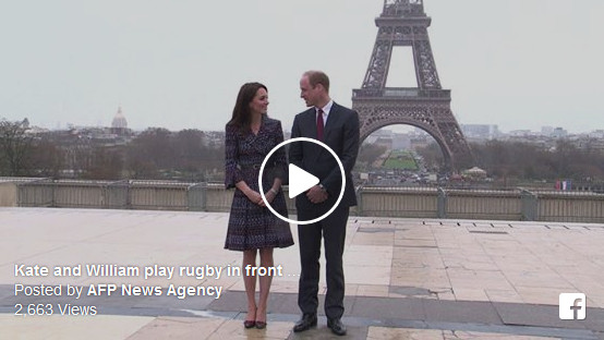 Britain's Prince William and his wife Kate play rugby with children in front of the Eiffel Tower in Paris