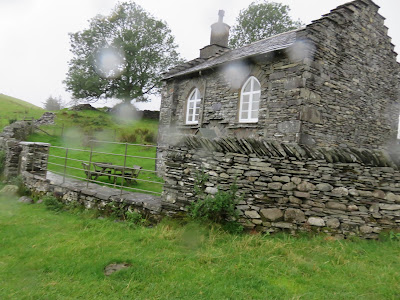 Stone house with raindrops on view