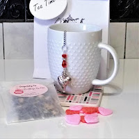 This lovely Valentine Tea Gift Set includes a Beaded Heart Infuser with hand blended loose leaf tea, pink and red sugar slices, and packaged in a gift bag with a gift tag. 