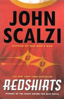 Cover of Redshirts (The front portion of a futuristic space uniform bears an insignia resembling the "star trek" logo).