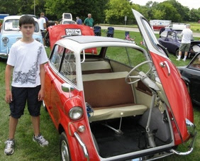 Among the slowest cars in the world is BMW Isetta 250. but this picture is about model 600 toshow how 250 door is being opened.