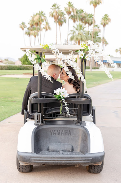 bride and groom in a golf cart at the AZ Golf Resort