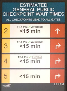 Reader board with estimated security wait times at Sea-Tac Airport