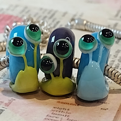 glass charm bead snails