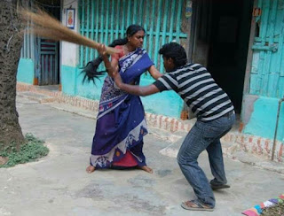 MAN GETTING BEATEN BY WOMAN